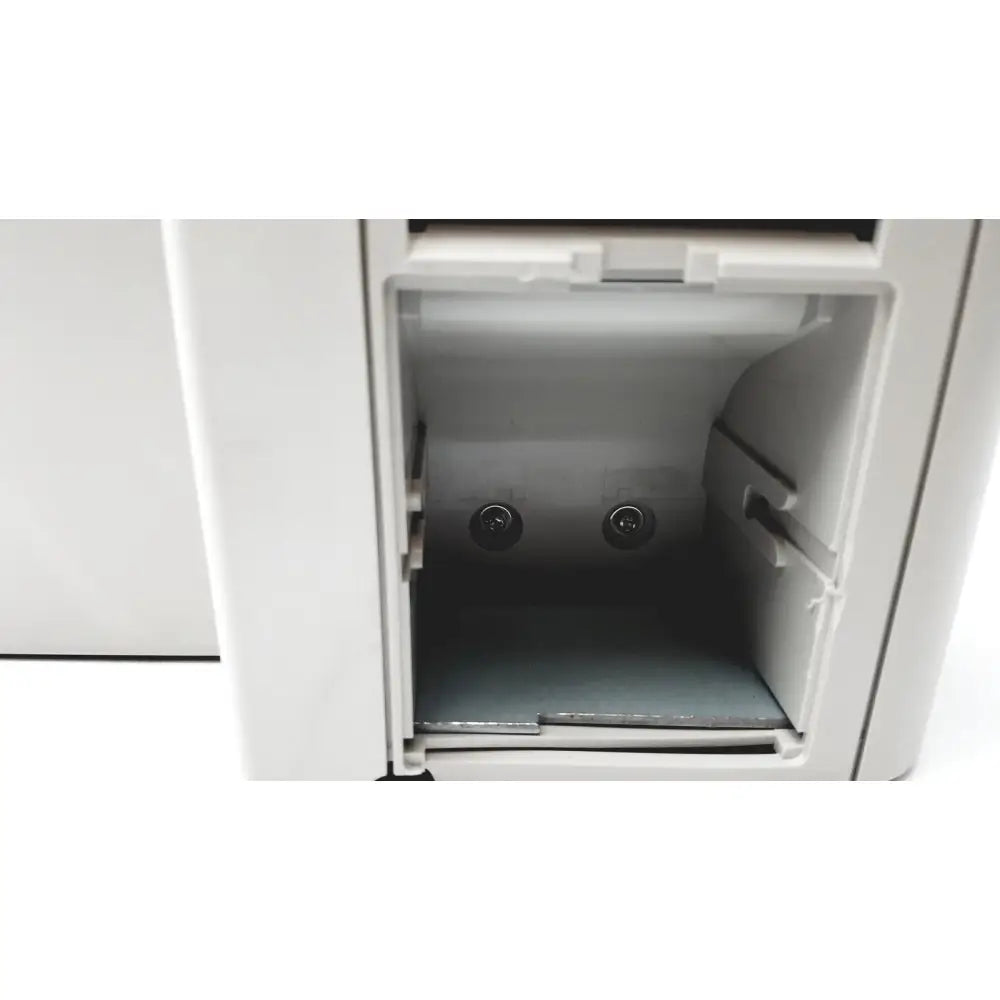 White plastic cash register receipt drawer with two circular slots and gray tray for topcon medical advance automatic lensmeter