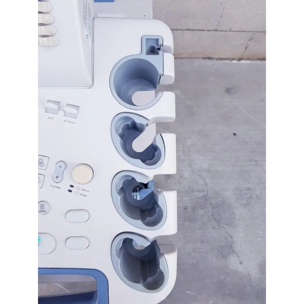 White and blue toshiba nemio 10 ultrasound machine with multiple circular probe holders missing parts as is view