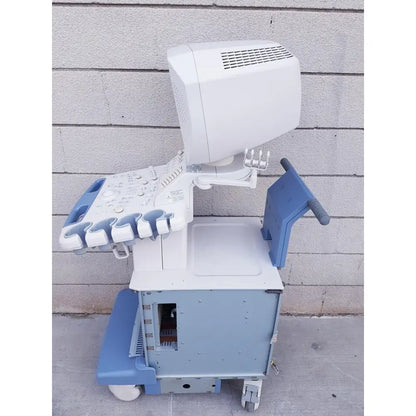White and blue toshiba nemio 10 ultrasound machine on wheeled cart with monitor and control panel for reuse medical use as is