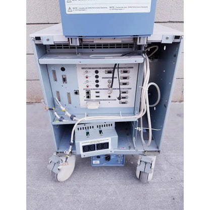 Light blue medical imaging cart with multiple ports power outlets and wheels at the back of toshiba nemio 10 ultrasound machine missing parts as is