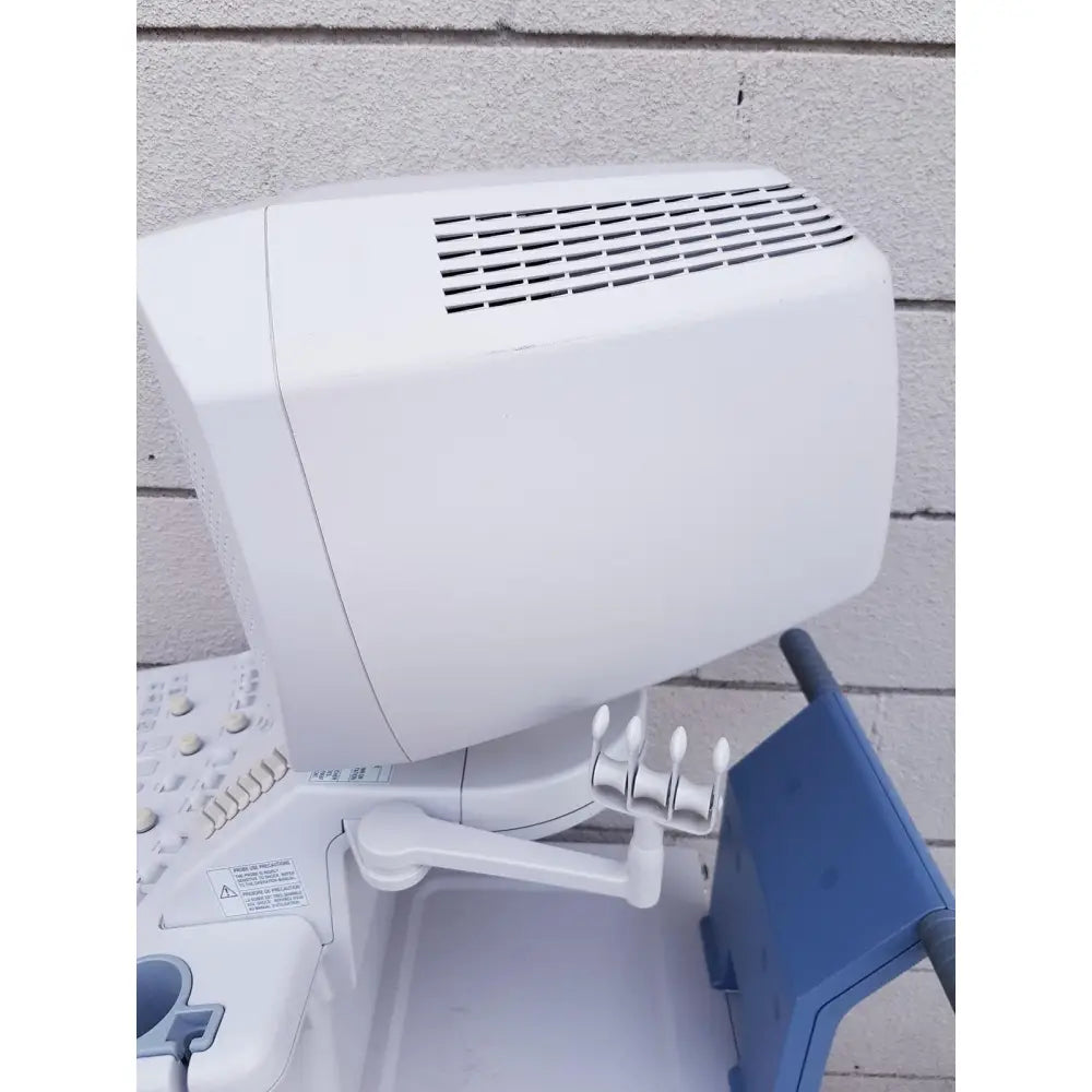 White plastic toshiba nemio ultrasound machine with vented top and articulated arm missing parts as is