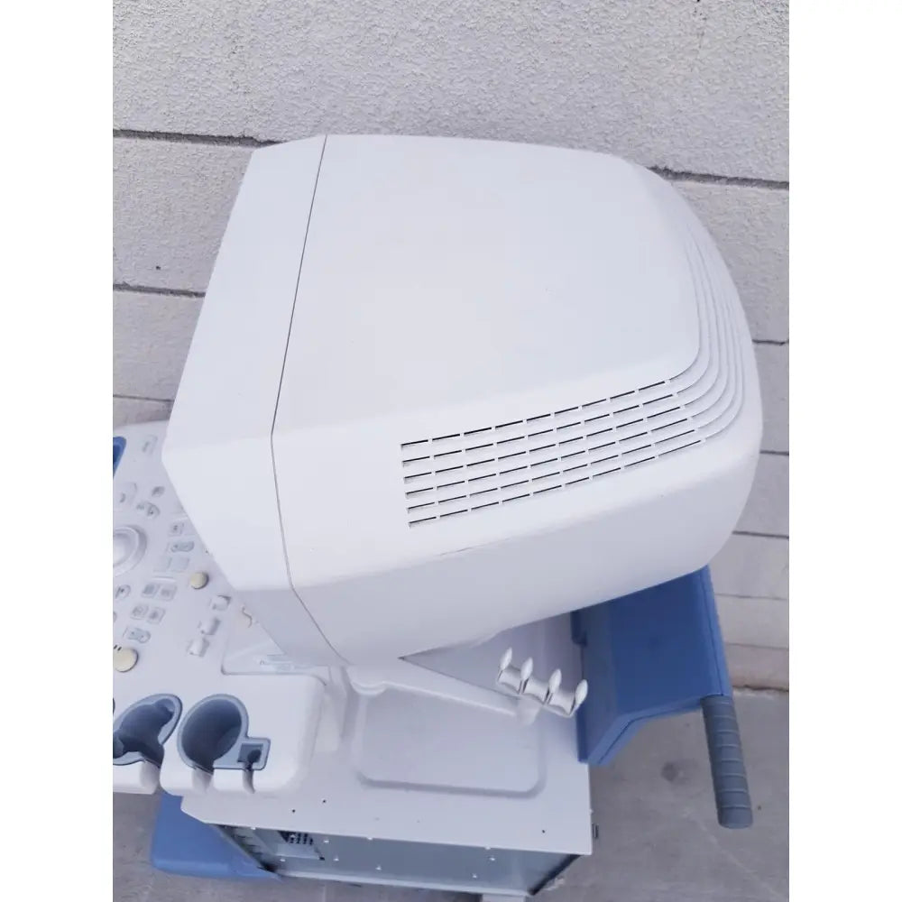 White toshiba nemio ultrasound machine with sleek rounded top and ventilation slits for reuse medical applications missing parts as is