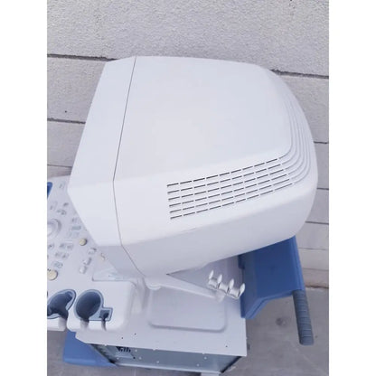White toshiba nemio ultrasound machine with sleek rounded top and ventilation slits for reuse medical applications missing parts as is