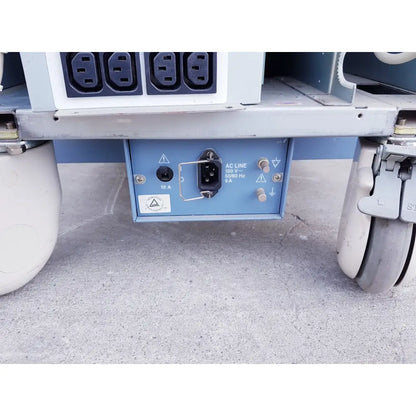 Back side of blue electrical power input panel with black ac plug on toshiba nemio ultrasound machine for reuse medical purposes