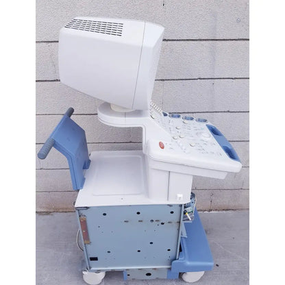 White and blue toshiba nemio 10 ultrasound machine with monitor control panel and wheeled base for reuse medical purposes