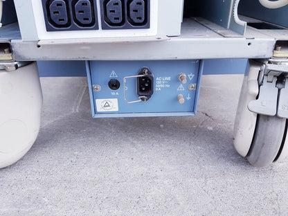 Back side of blue electrical power input panel with black ac plug on toshiba nemio ultrasound machine for reuse medical purposes