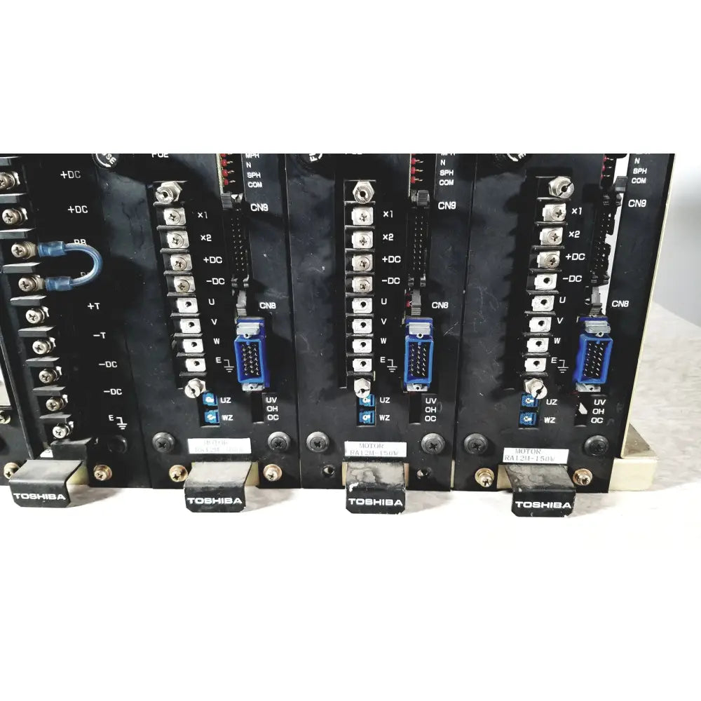 Black toshiba ra power rad92-1008 industrial control modules with blue connectors and silver terminal blocks for power supply