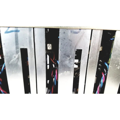 Silver metal server rack with vertical slats and visible wiring showing the back of toshiba ra power rad92-1008 power supply