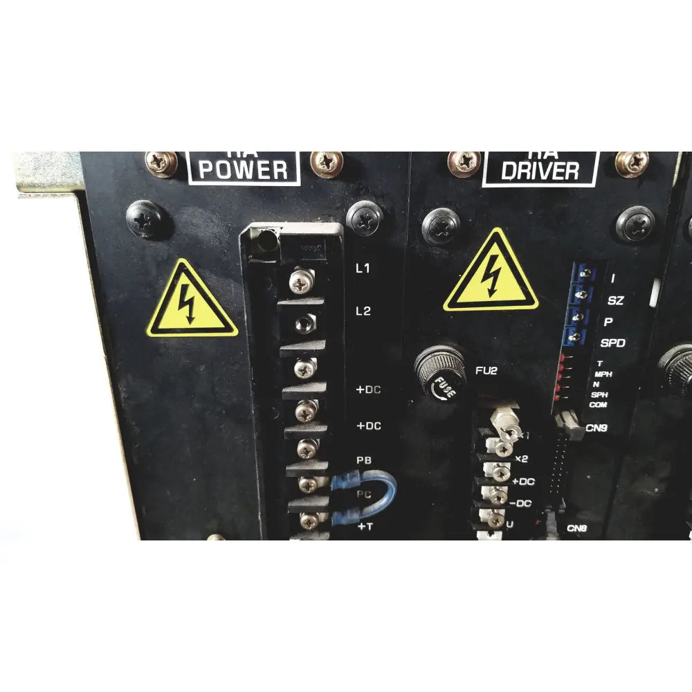 Black industrial control panel of toshiba ra power rad92-1008 dc power supply with yellow warning labels and terminal blocks
