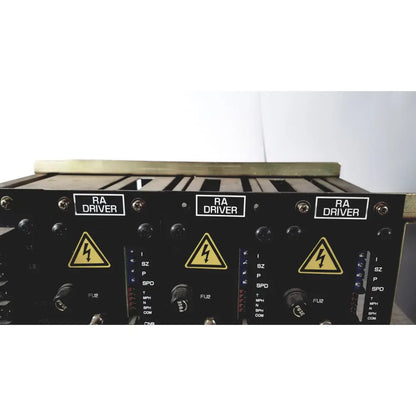 Black aviation ra driver modules with yellow lightning hazard symbols on labeled control panels of toshiba ra power rad92-1008 power supply back side