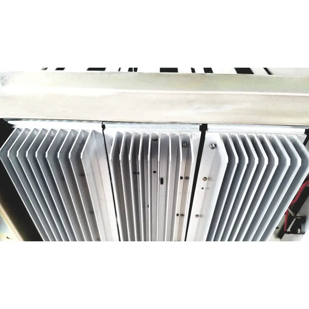 Silver-colored aluminum heat sink with parallel fins and mounting screws on toshiba ra power rad92-1008 power supply