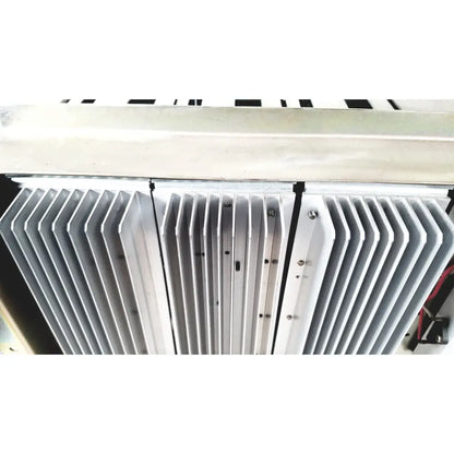 Silver-colored aluminum heat sink with parallel fins and mounting screws on toshiba ra power rad92-1008 power supply
