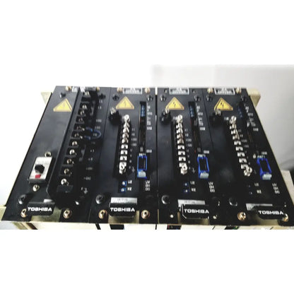 Black Toshiba RA power RAD92-1008 industrial control panels with silver connectors and blue terminal blocks for power supply