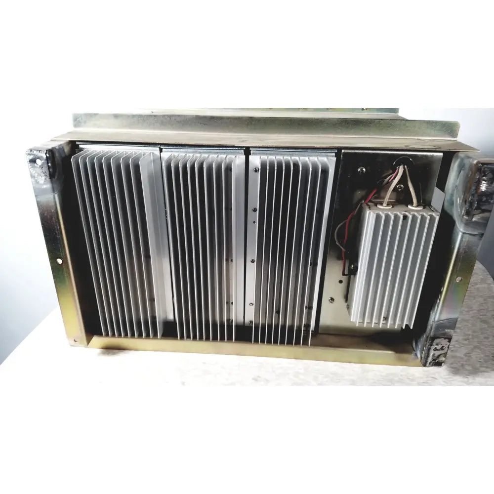 Silver-colored metal heat sink with vertical fins and internal wiring on the toshiba ra power rad92-1008 power supply