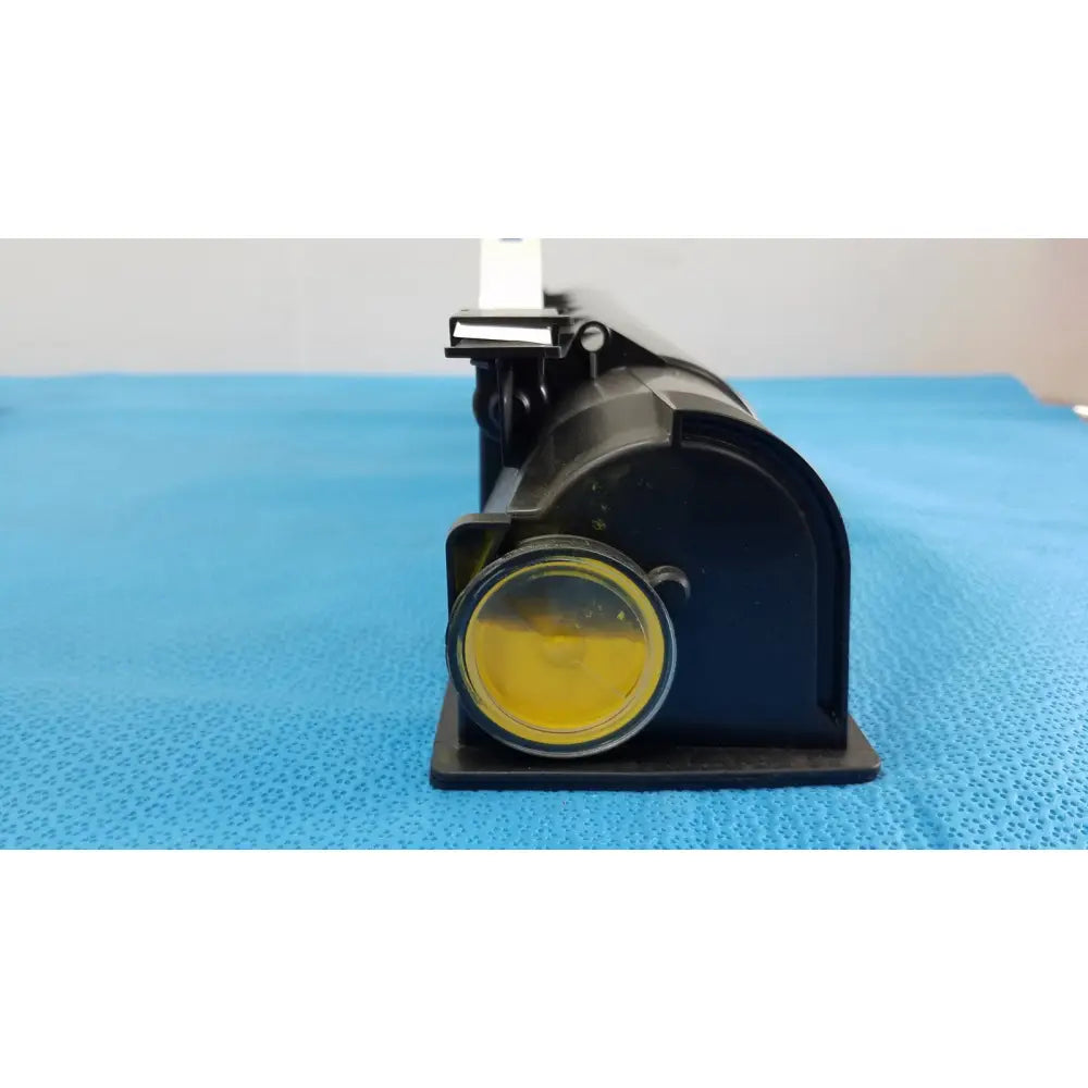 Black plastic projector with yellow lens and white mount for genuine Toshiba toner T-FC28-Y product use