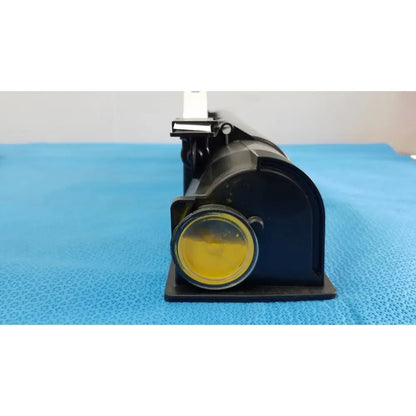Black plastic projector with yellow lens and white mount for genuine Toshiba toner T-FC28-Y product use