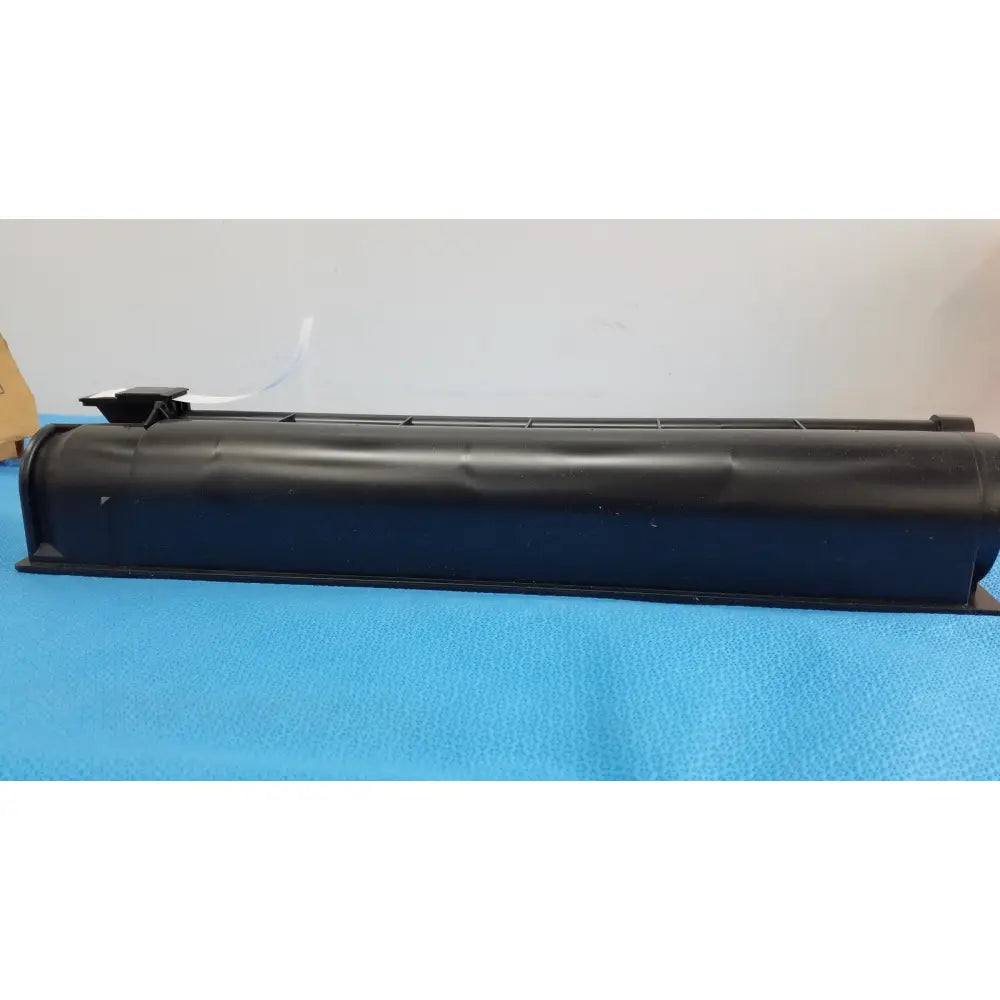 Black plastic rectangular genuine Toshiba toner cartridge T-FC28-Y with ridged top surface for printer use