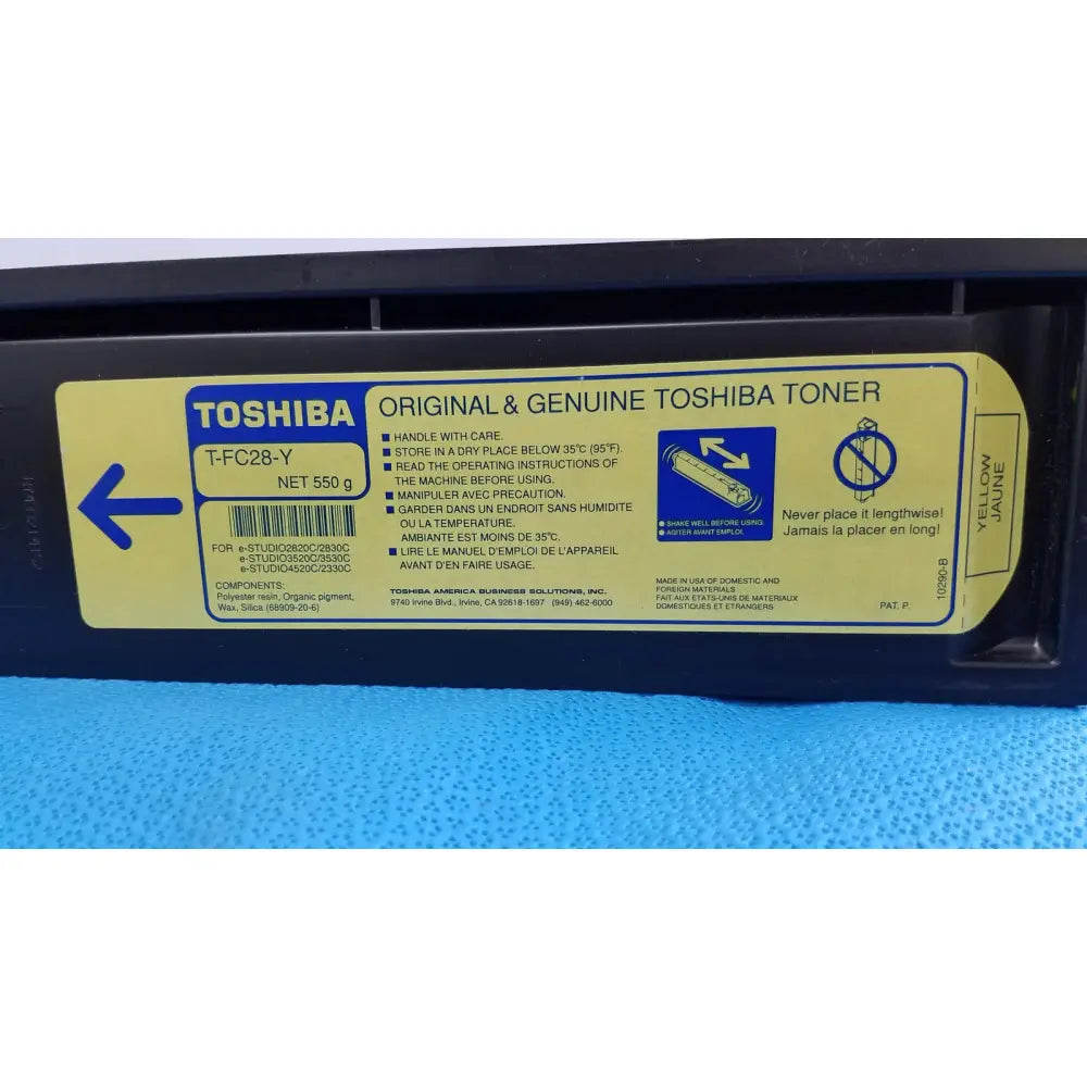 Yellow genuine toshiba toner t-fcc28-y original cartridge with black plastic casing and multilingual printed instructions