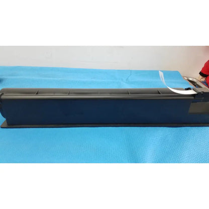 Black plastic genuine toshiba toner cartridge t-fc28-y with white label and metallic components on right side