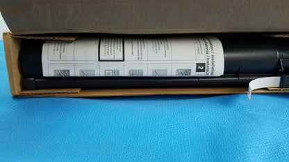 Black cylindrical caulking gun with white label for genuine toshiba toner t-fc28-y original and genuine toshiba product
