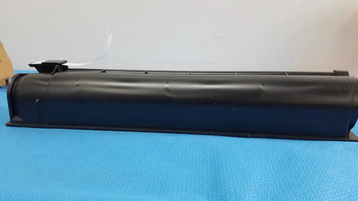 Black plastic rectangular genuine Toshiba toner cartridge T-FC28-Y with ridged top surface for printer use