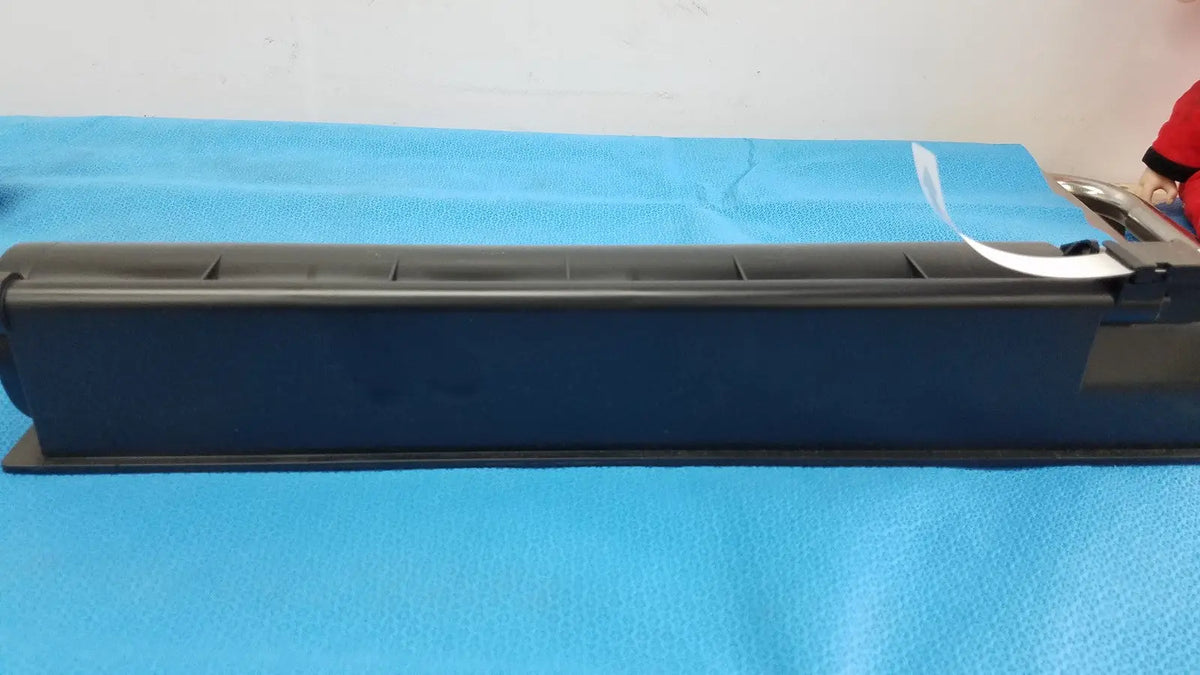 Black plastic genuine toshiba toner cartridge t-fc28-y with white label and metallic components on right side