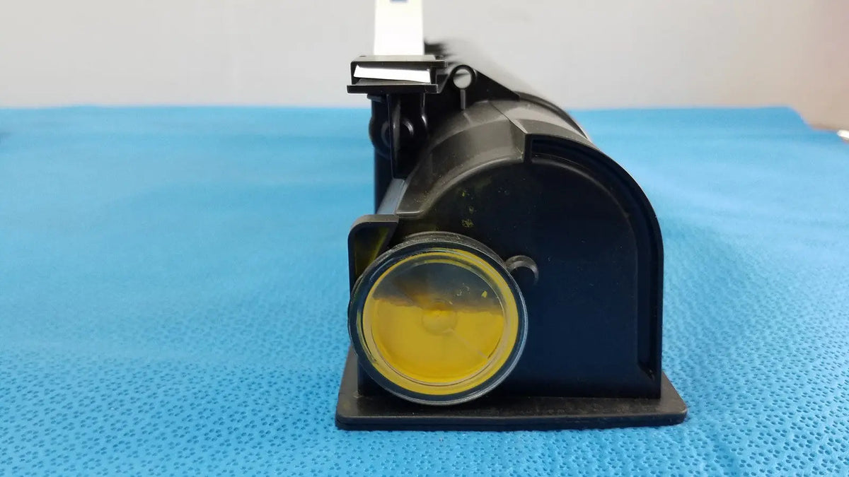 Black plastic projector with yellow lens and white mount for genuine Toshiba toner T-FC28-Y product use