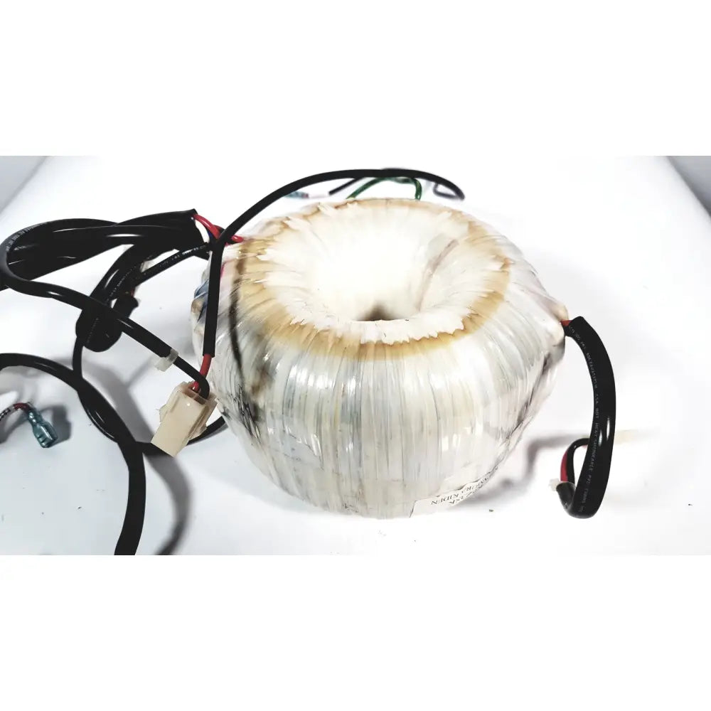 A white cylindrical toshiba transformer bsm31-4471e with ribbed surface and black wiring for xario ultrasound systems