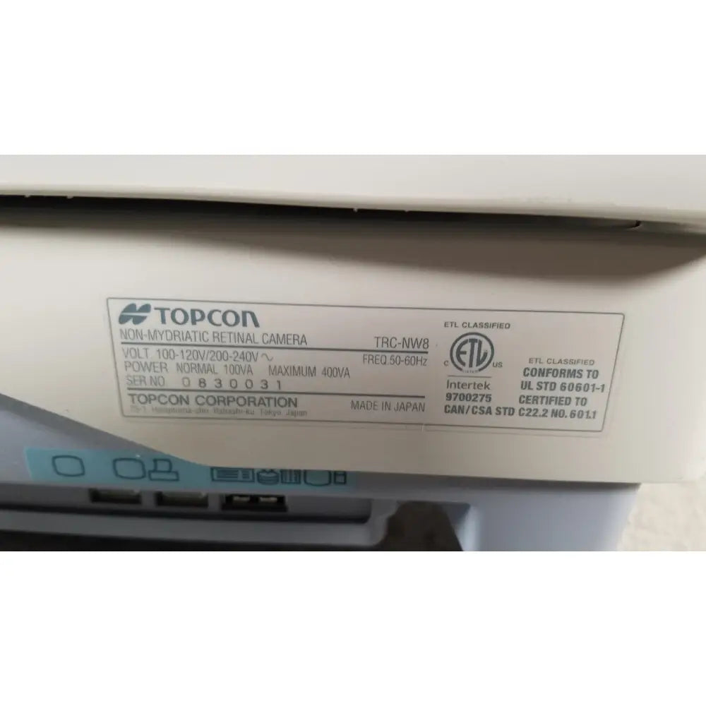 White topcon trc-nw8 non-mydriatic retinal camera with label showing technical specs in tracey iTrace visual function WSL524M device