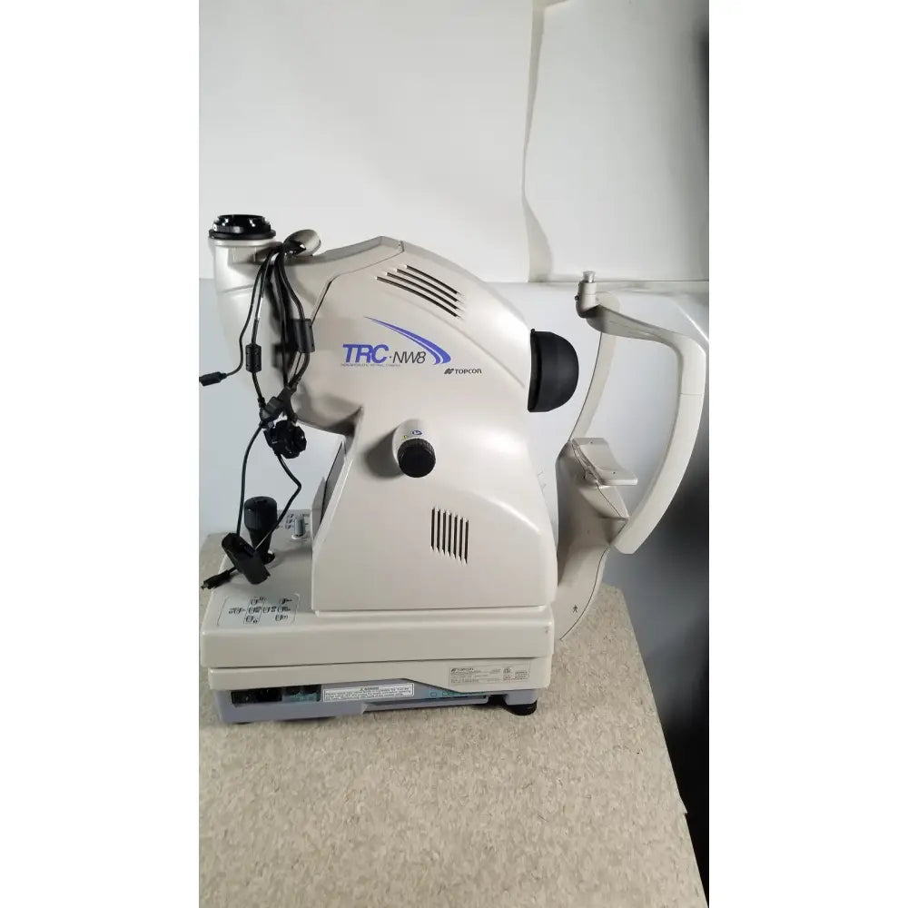 Beige and gray topcon trc nw8 slit lamp biomicroscope featured in tracey itrace visual function analyzer wsl524m model