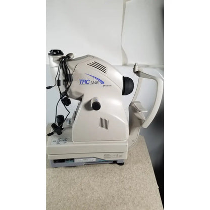 Beige and gray topcon trc nw8 slit lamp biomicroscope featured in tracey itrace visual function analyzer wsl524m model