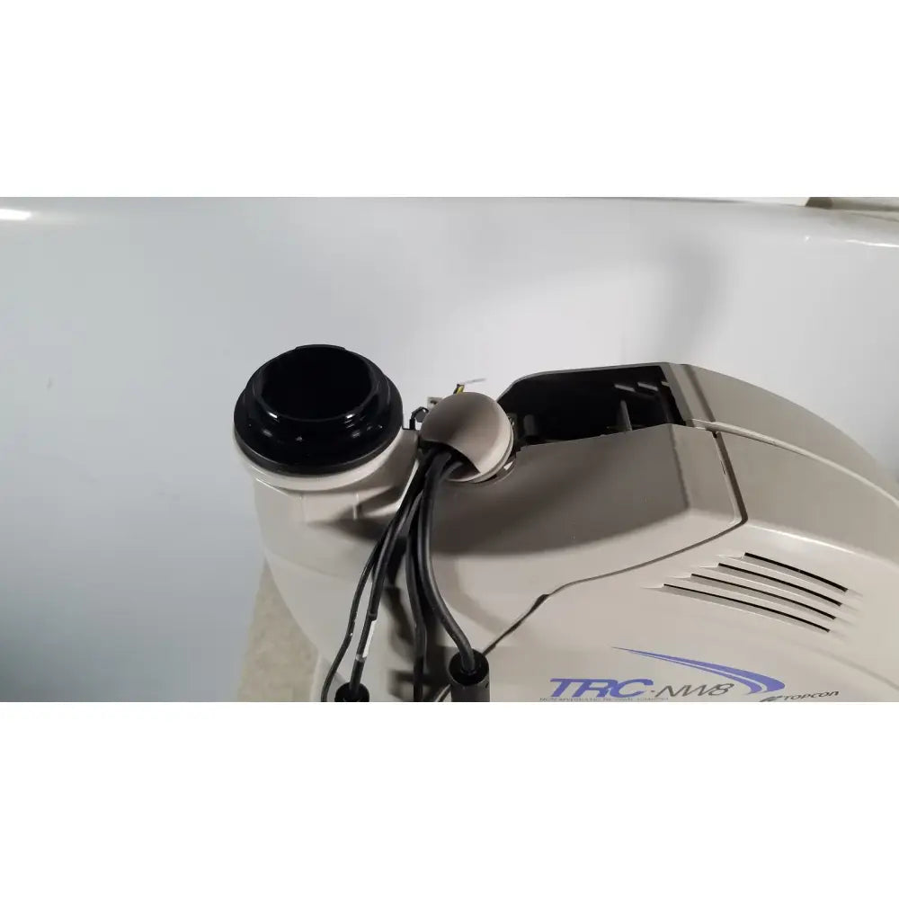 Beige and black trucolor trc-nw8 pool cleaner with cylindrical intake port shown with tracey itrace visual function analyzer wsl524m