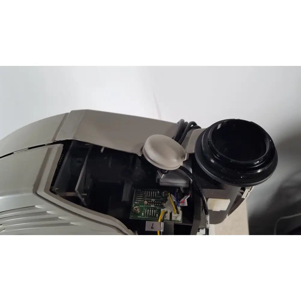 Gray plastic casing of tracey itrace visual function analyzer wsl524m with black cylinder and white cap showing circuit board interior