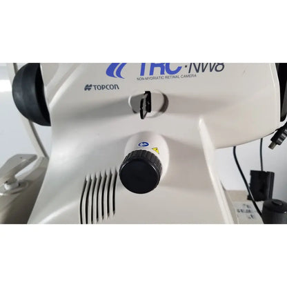 White topcon trc-nw8 non-mydriatic retinal camera with black control knob in tracey itrace visual function analyzer wsl524m model