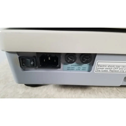 Back view of gray plastic power supply unit with black switch and ac socket on tracey itrace visual function analyzer wsl524m