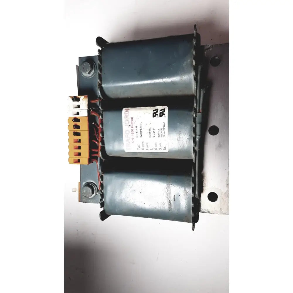 Gray metal trafo jordi ch-4950 huttwil transformer with two cylindrical coils and specification label visible