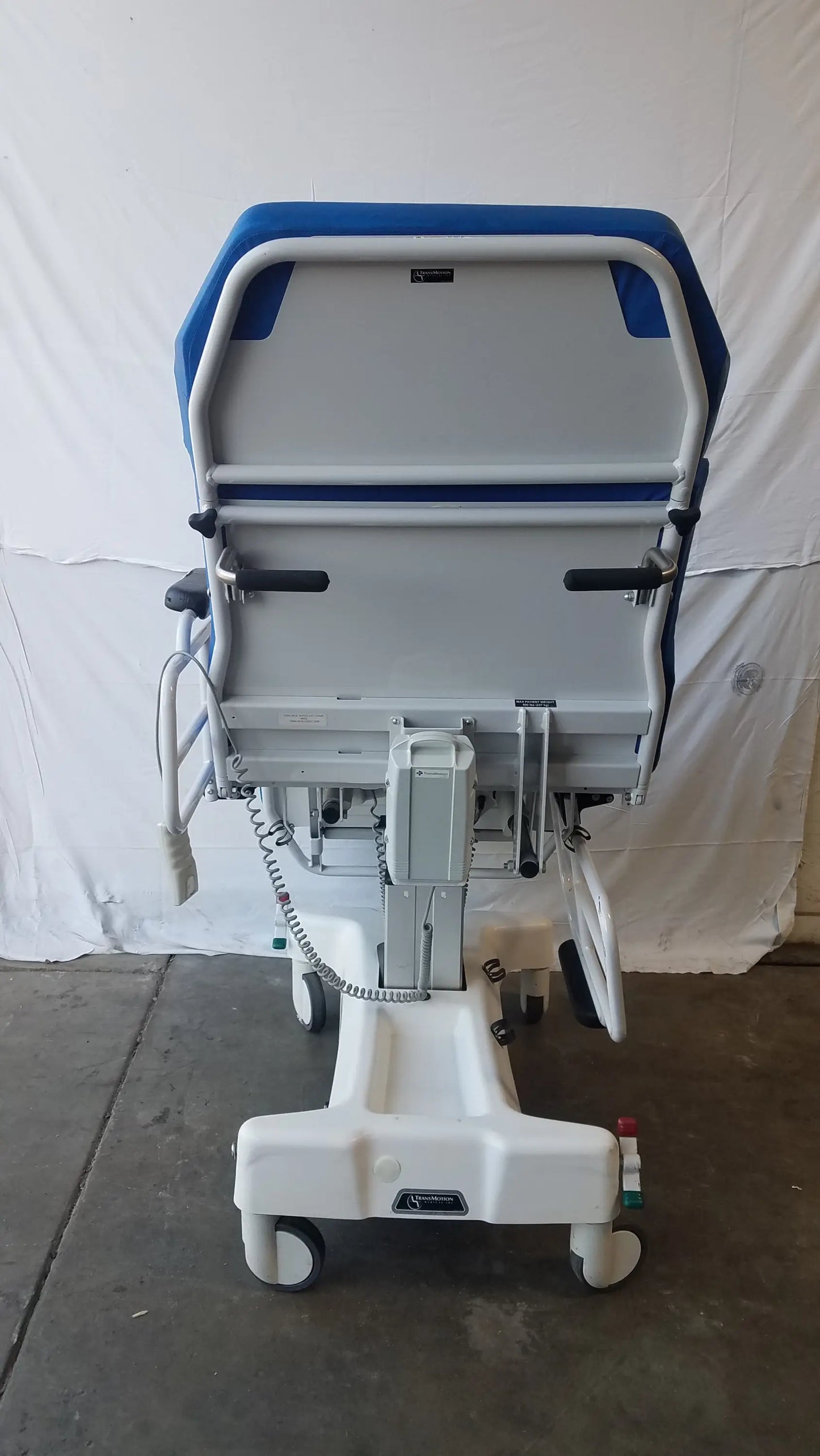 TransMotion Medical TMM4 multi purpose stretcher chair in blue and gray with adjustable height and caster wheels for mobility