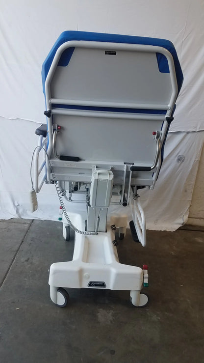 Blue and white TransMotion Medical TMM4 multi purpose stretcher chair with adjustable backrest metal frame and caster wheels