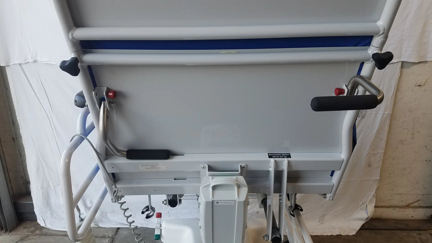 White TransMotion Medical TMM4 multi purpose stretcher chair with blue trim and black hand grips for versatile medical use