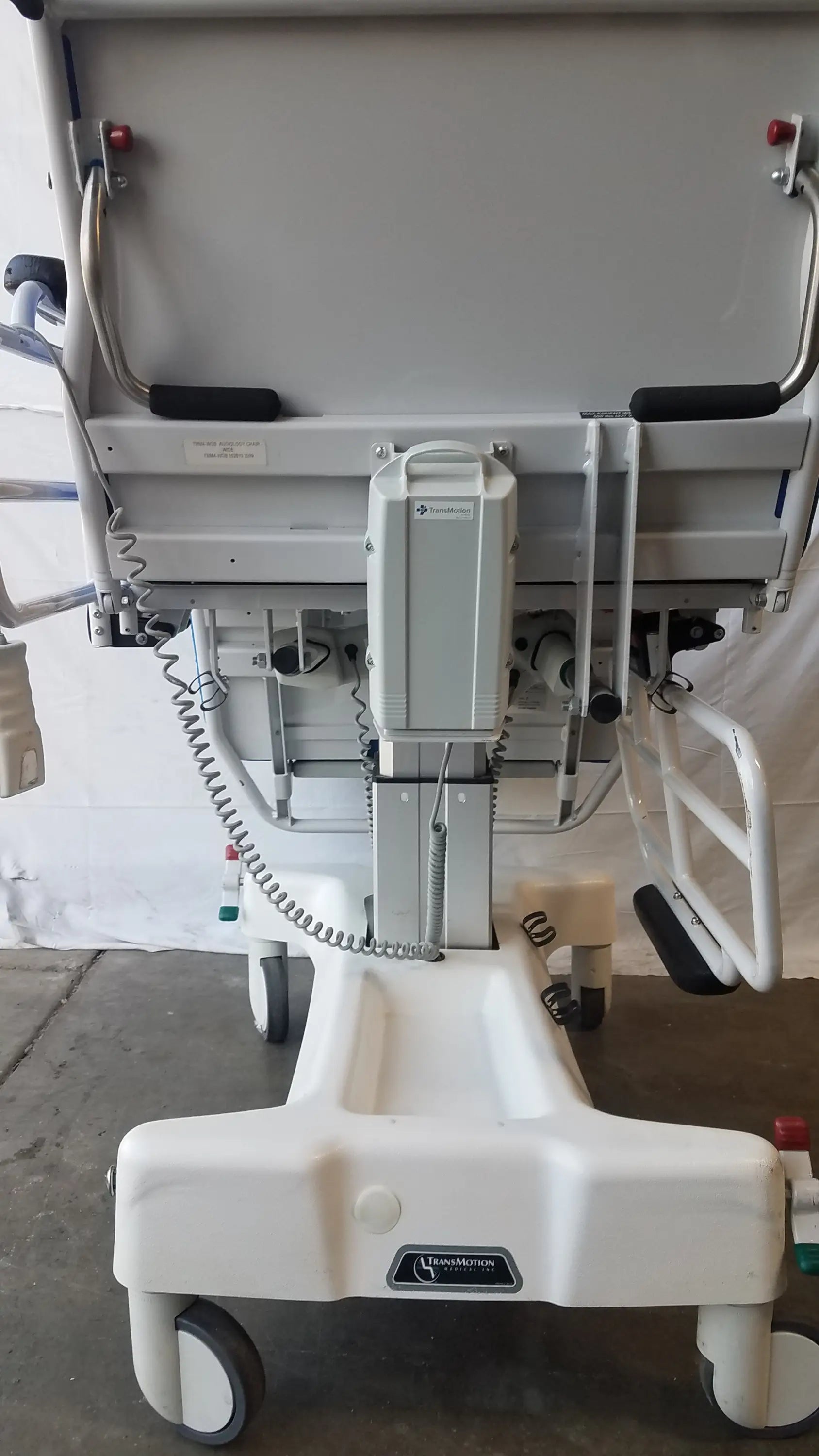 White transmotion medical tmm4 multi purpose stretcher chair with adjustable height and safety rails for patient care