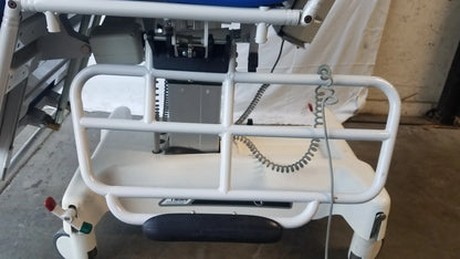 White metal safety rail with black rubberized footrest on TransMotion Medical TMM4 multi purpose stretcher chair