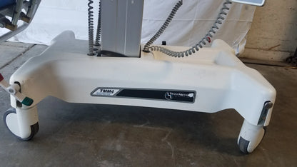 White plastic base of transmedic tmm4 multi purpose stretcher chair with four caster wheels and coiled gray cables