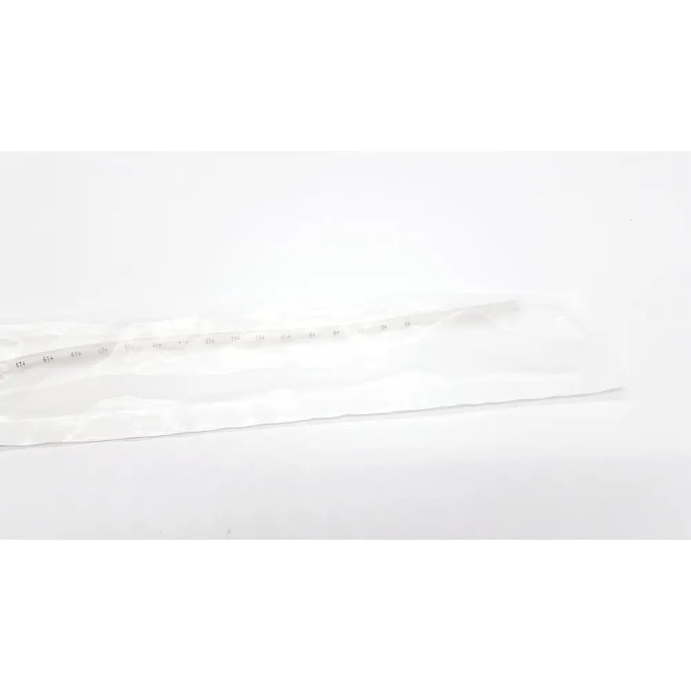 A clear plastic ruler with black centimeter markings used for measurement in tri-flo suction catheter with control port ref t260c
