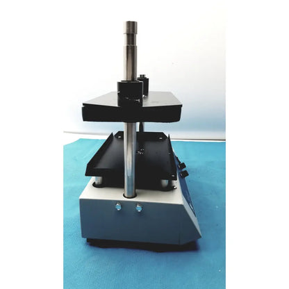 Black and silver metallic tripath imaging multi-vial vortexer 30cr000106 with sturdy column and control knobs on side