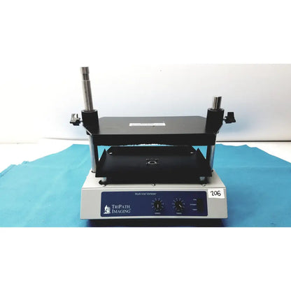Black tripath imaging multi-vial vortexer 30cr000106 with silver control panel and numbered label for lab mixing tasks