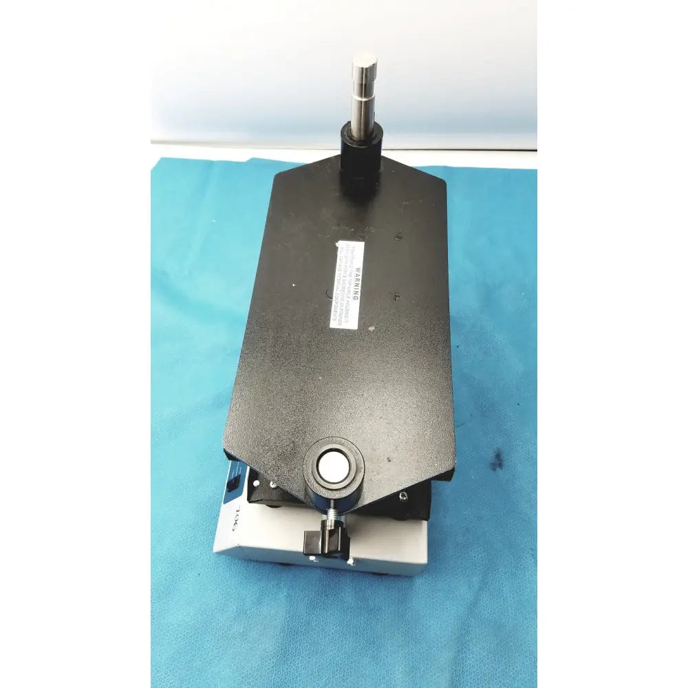 Black rectangular precision measurement stage with silver spindle and blue adjustment knob for tripath imaging multi-vial vortexer 30cr000106