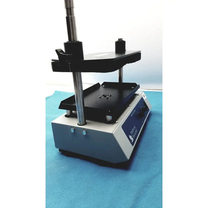 Gray and black laboratory-grade hot plate with adjustable height and side control panel by tripath imaging multi-vial vortexer 30cr000106