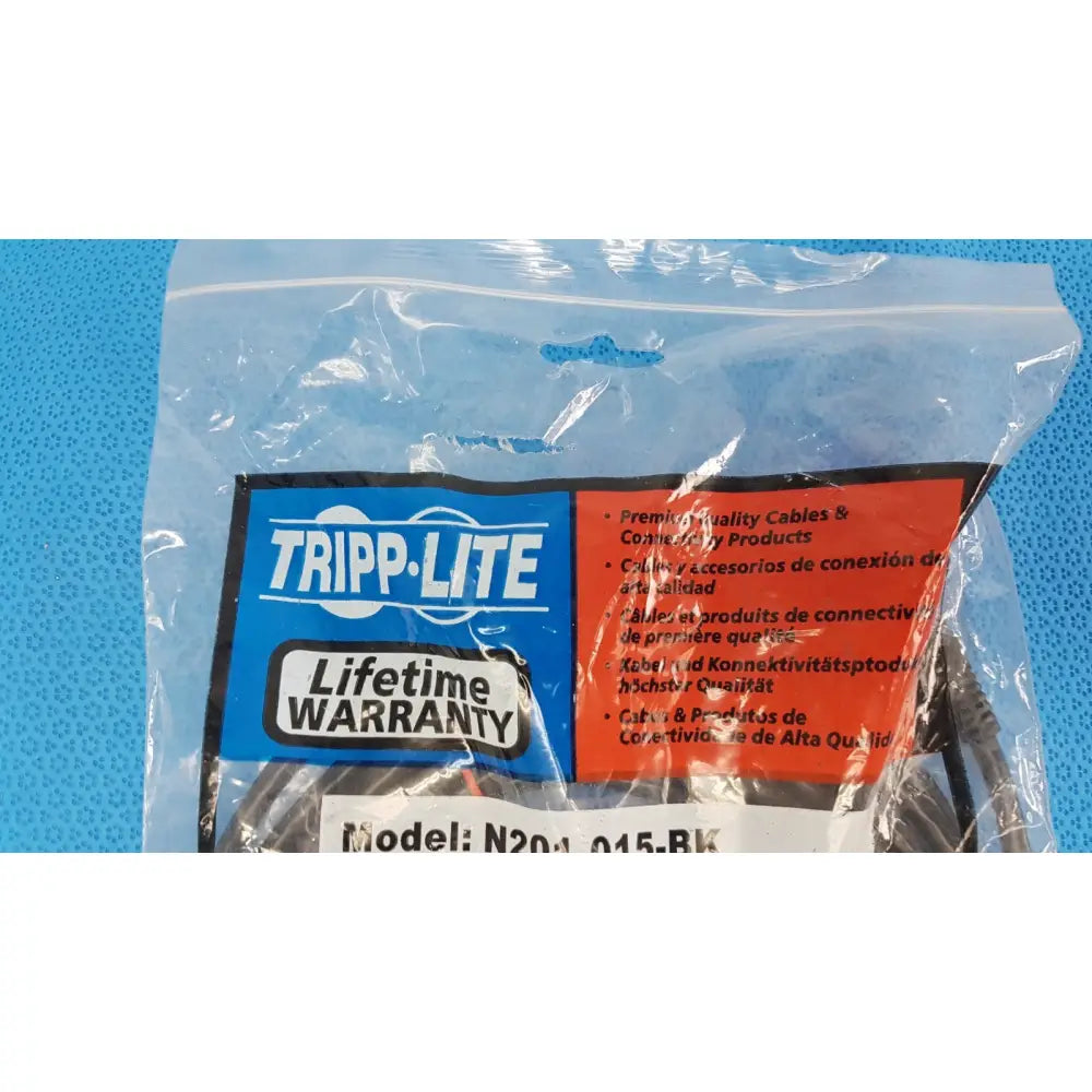 Tripp Lite 15ft cat6 patch cable in clear plastic packaging with blue and red label for gigabit networking use