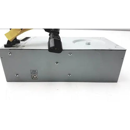 Silver metallic tripp lite hc150sl medical cart power supply unit with black ac input plug and labeled usb port backside