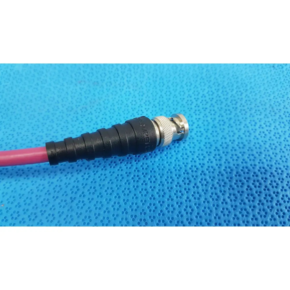 Black and silver bnc connector with threaded housing and black strain relief on pink trompefter 14949-upcwx-24-75 video patch cord